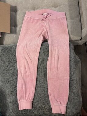 y2k vintage pink Juicy Couture velour track pants with snap-back pockets